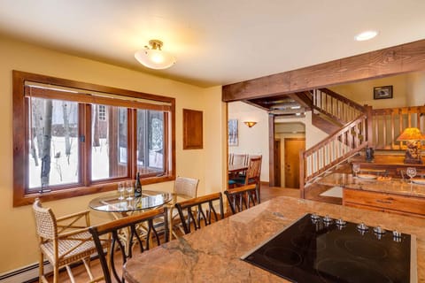 The kitchen features bar seating for six and a two person breakfast table.