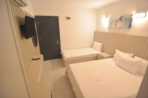 Standard Triple Room | Individually decorated, iron/ironing board, free WiFi, bed sheets