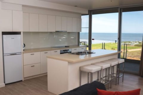 Deluxe One Bedroom Apartment - Ocean View | Private kitchen | Coffee/tea maker, freezer, kitchen islands