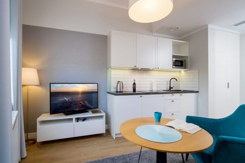 Apartment, 1 Bedroom | Living area | 42-inch flat-screen TV with cable channels, TV