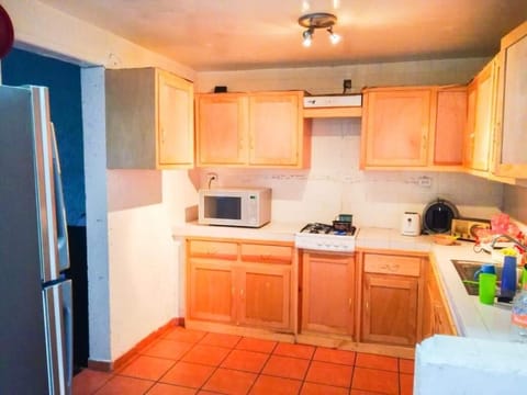 Fridge, microwave, cookware/dishes/utensils