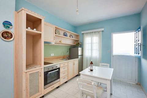 Apartment | Private kitchen | Fridge, stovetop, electric kettle, cookware/dishes/utensils