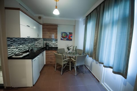 Apartment, 2 Bedrooms | Private kitchen | Fridge, stovetop, coffee/tea maker, electric kettle