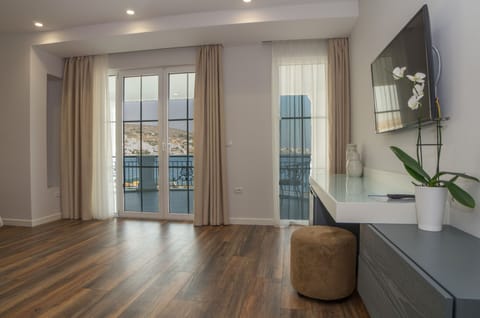 Superior Suite, Sea View | Living area | Flat-screen TV