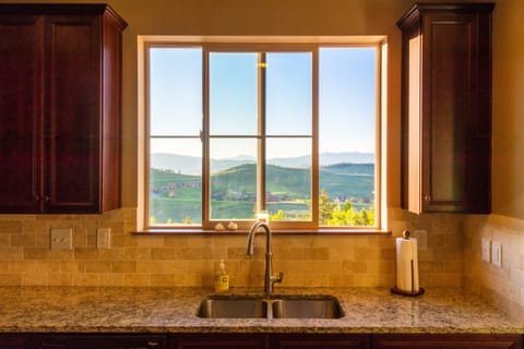 Kitchen window glowing around sunset.