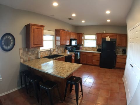Granite counters, breakfast bar, dishwasher, oven, microwave, Kuerig and more.