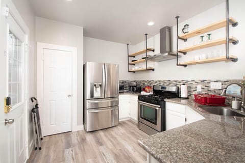 Fully stocked kitchen with all major and small appliances to prepare meals