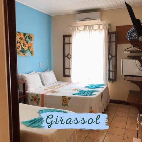 Triple Room | Minibar, blackout drapes, free WiFi, bed sheets