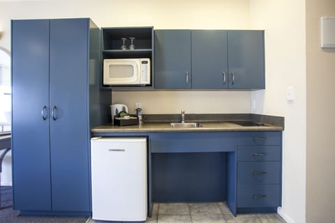 Two Bedroom Suite | Private kitchen | Fridge, microwave, stovetop, coffee/tea maker