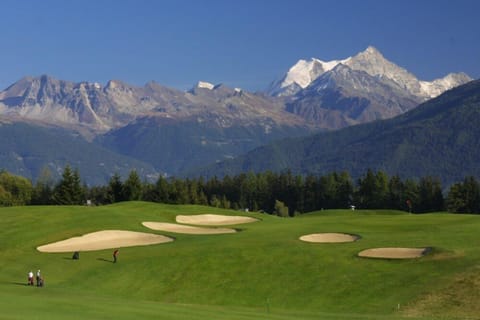 Tee off onto the mountains from the world famous 18-hole golf course of Crans!