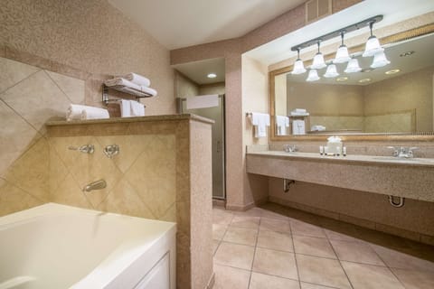 Presidential Suite, 1 King Bed, Jetted Tub | Bathroom | Combined shower/tub, free toiletries, hair dryer, towels