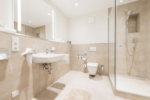 Prestige Suite | Bathroom | Shower, rainfall showerhead, eco-friendly toiletries, hair dryer