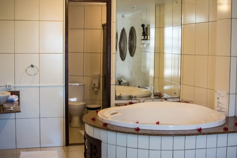 Suite, Jetted Tub | Bathroom | Hair dryer, towels