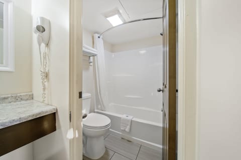 Standard Room, 1 King Bed | Bathroom | Deep soaking tub, free toiletries, towels