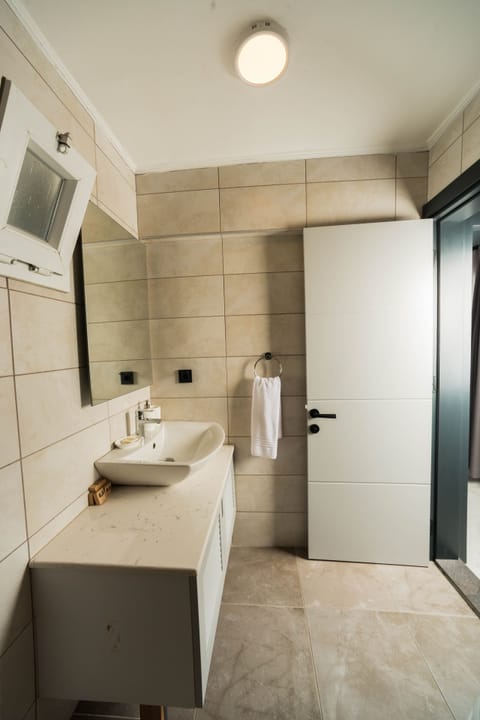 Suite, 2 Bedrooms | Bathroom | Shower, free toiletries, hair dryer, slippers