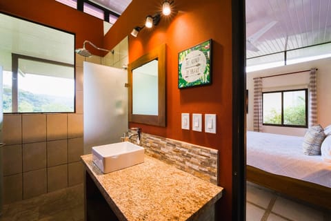 Deluxe Casita, 1 King Bed Heliconia | Bathroom | Shower, rainfall showerhead, eco-friendly toiletries, hair dryer