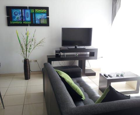 Family Room (Sextuple 2 Double and 2 Single Beds) | Living area | 32-inch flat-screen TV with cable channels, TV