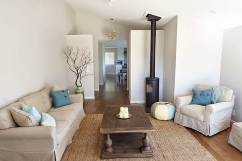 View of living room and wood burning stove, ideal for cool winter evenings