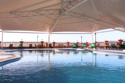 Indoor pool, outdoor pool, pool umbrellas