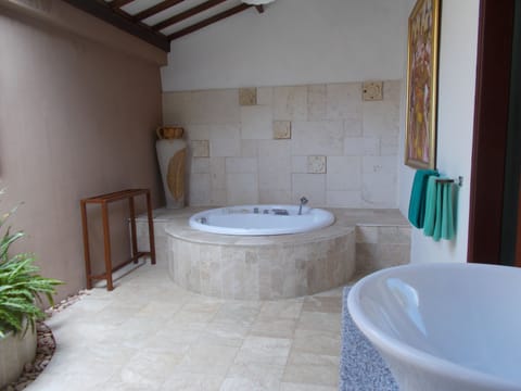 Villa, 1 Bedroom | Bathroom | Separate tub and shower, rainfall showerhead, free toiletries