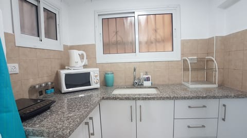 Comfort Apartment, 2 Bedrooms | Private kitchen | Full-size fridge, microwave, stovetop, coffee/tea maker