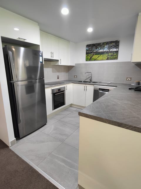 Executive Apartment, 2 Bedrooms | Private kitchen | Full-size fridge, microwave, stovetop, coffee/tea maker