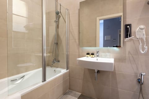 Quadruple Room, Balcony | Bathroom | Shower, free toiletries, hair dryer, towels