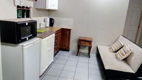 Fridge, microwave, cookware/dishes/utensils