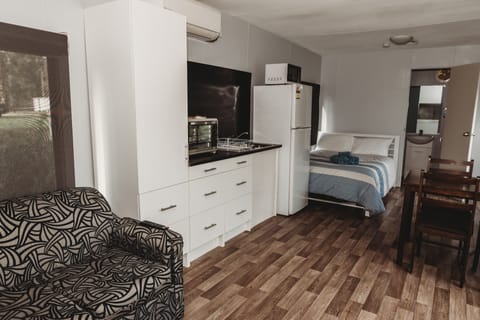 Budget Ensuite Cabin | Private kitchenette | Full-size fridge, microwave, stovetop, coffee/tea maker