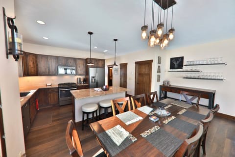 Large dining table, seats 8 comfortably, has built in leaf to expand for 10.