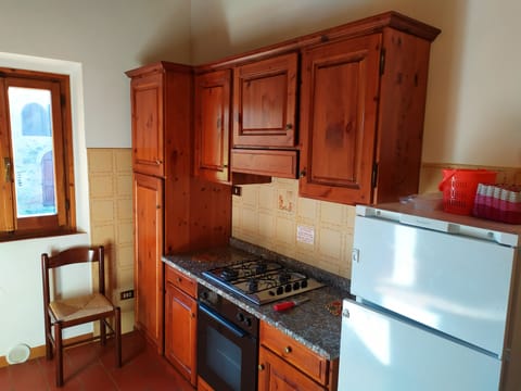 Family Apartment, 3 Bedrooms, Garden View (Il Focolare) | Private kitchen | Full-size fridge, microwave, oven, stovetop