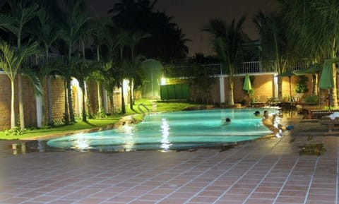 Outdoor pool, open 7 AM to 10 PM, pool umbrellas, sun loungers