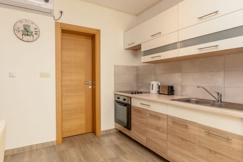 Deluxe Apartment, 2 Bedrooms, Balcony, Sea View | Private kitchen | Full-size fridge, oven, stovetop, electric kettle