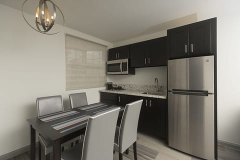 Family Suite, 2 Bedrooms, Kitchen | Private kitchen | Fridge, coffee/tea maker, electric kettle, cookware/dishes/utensils