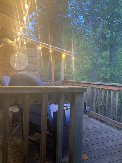 private deck with twinkle lights and deck cocktail table, chairs recline-dreamy!