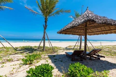 Private beach, white sand, sun loungers, beach umbrellas