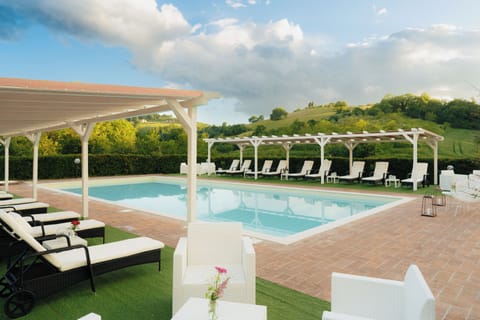 Seasonal outdoor pool, a rooftop pool, pool umbrellas, sun loungers