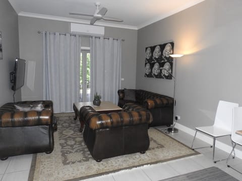 1 Bedroom Apartment | Living area | Flat-screen TV