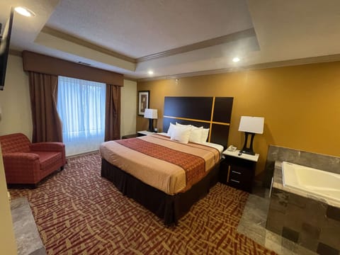 Suite, 1 King Bed, Non Smoking, Jetted Tub | Pillowtop beds, desk, laptop workspace, blackout drapes