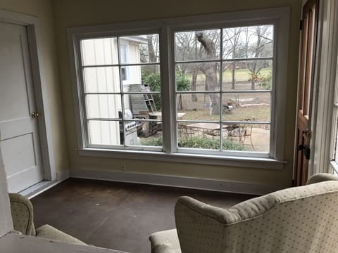 Sitting room looking out to back patio and pasture