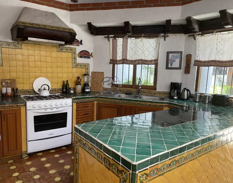 The kitchen has plenty of counter space w/ a marble inlaid as cutting board.