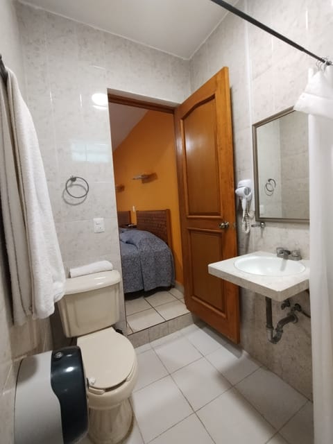 Standard Double Room, 2 Double Beds | Bathroom | Shower, free toiletries, hair dryer, towels