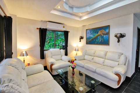 Exclusive Condo | Living room | 32-inch flat-screen TV with cable channels