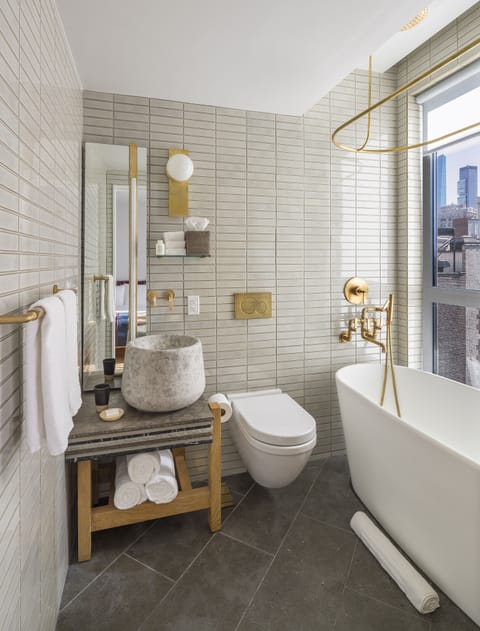 Executive Suite, Bathtub, City View | Bathroom | Shower, hair dryer, bathrobes, slippers