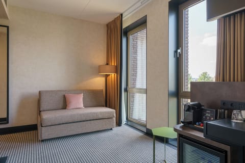 Superior Triple Room, Canal View | In-room safe, desk, laptop workspace, blackout drapes