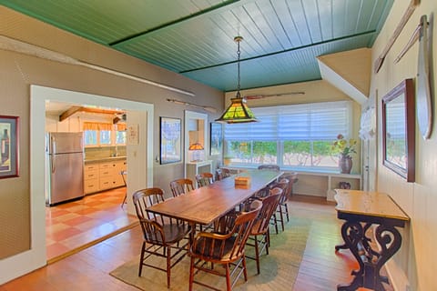 large dining room between kitchen and living room. Table sits 12, window seats 4