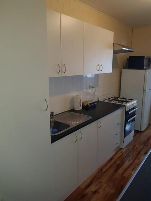 Apartment, 2 Bedrooms | Private kitchen | Fridge, microwave, coffee/tea maker, electric kettle