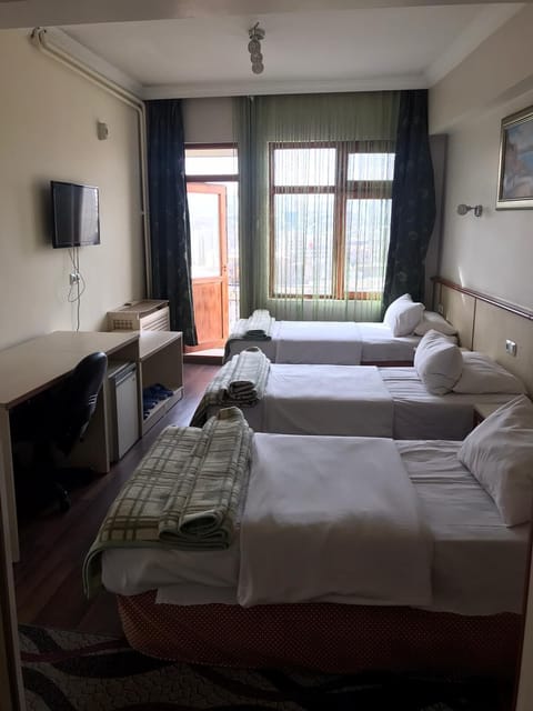 Standard Triple Room, Private Bathroom | Minibar, desk, iron/ironing board, free WiFi