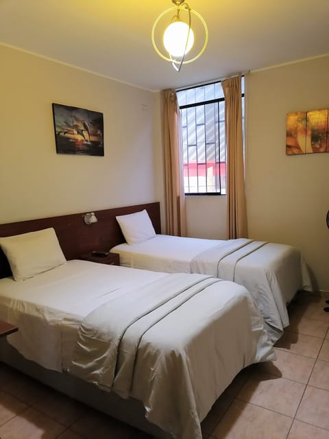 Economy Room, 2 Twin Beds | Iron/ironing board, free WiFi, bed sheets