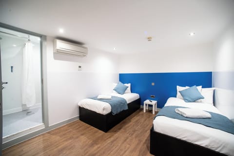 Twin Room, No Windows | Iron/ironing board, free WiFi, bed sheets, wheelchair access